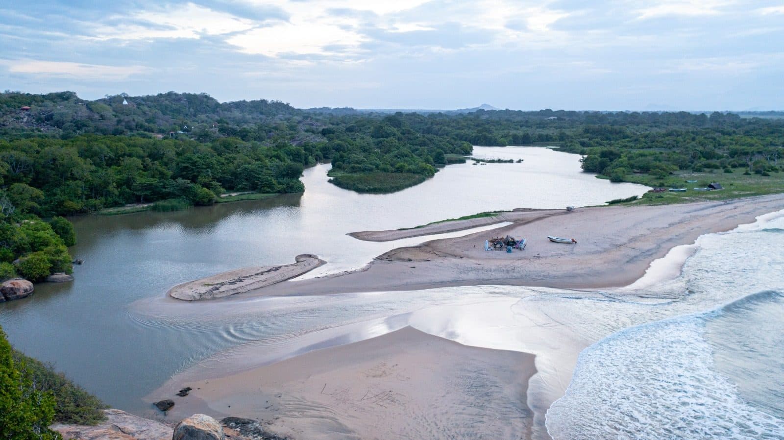 A sandbar where a river meets the sea
