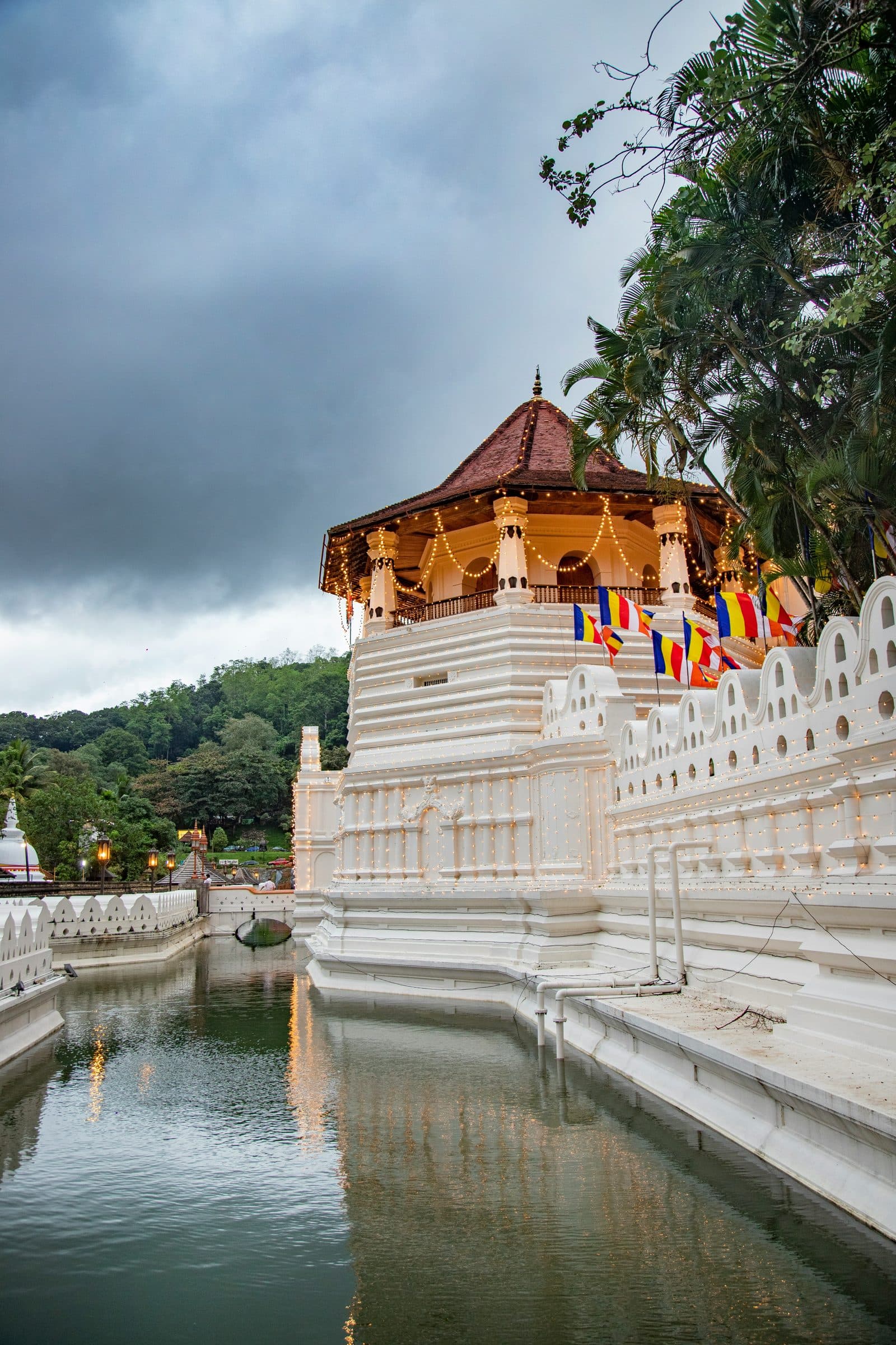 The Temple of the Sacred Tooth Relic reflected in its moat